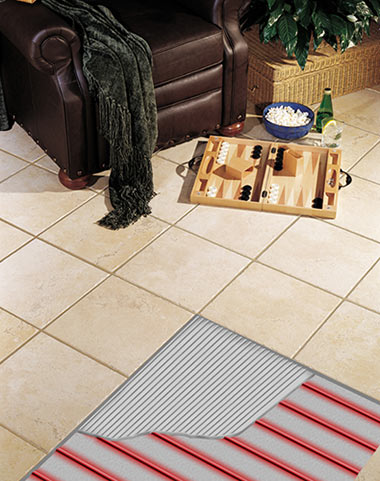 Radiant floor heating cable shown installed under tile floor. Radiant floor heating system and heat cable shown under tile.